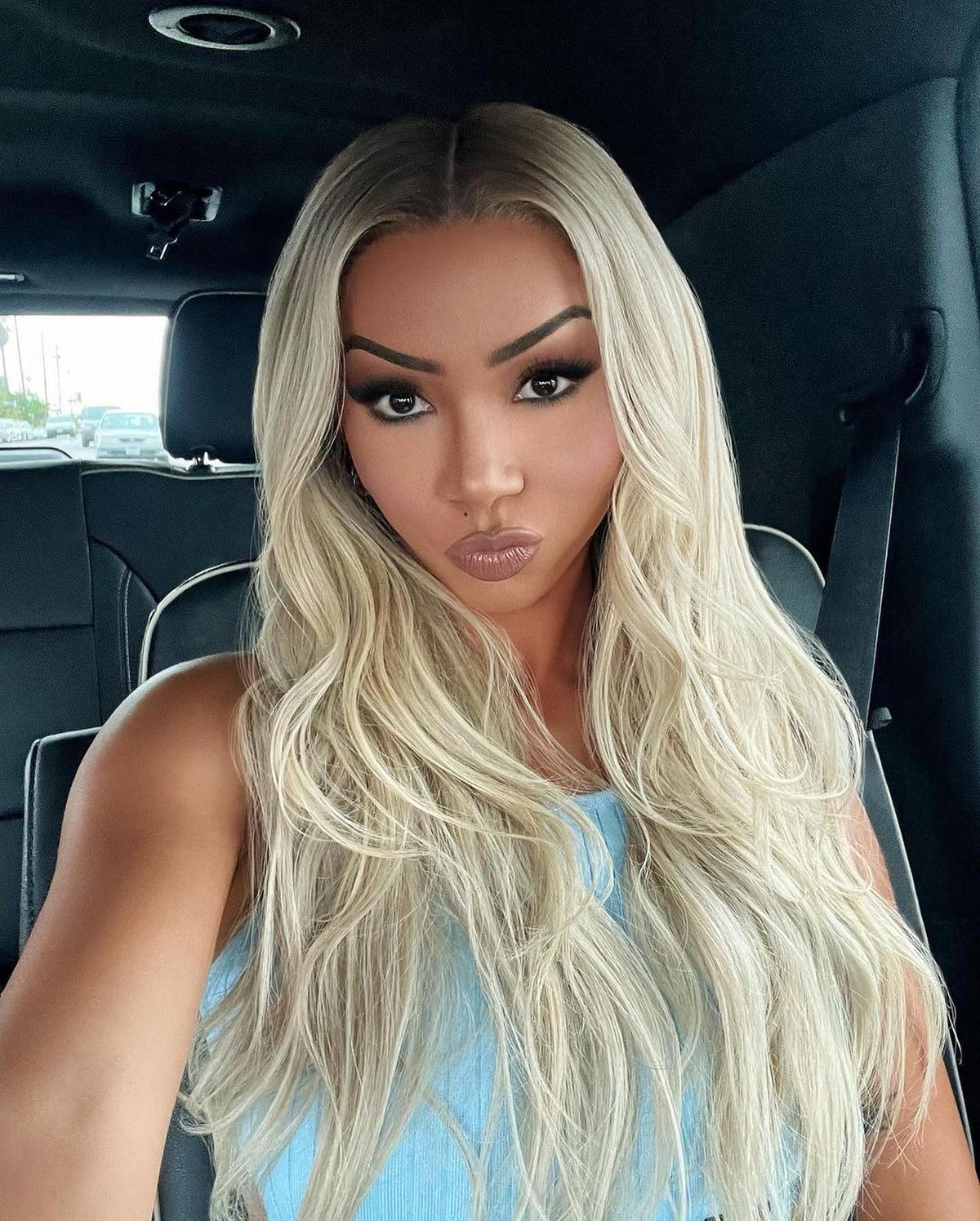 Long ash-blonde lace-front wig, center part, cascading wavy hair
