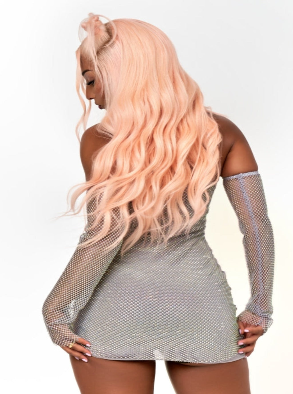 Pink lace wig with long wavy hair, side view, sheer lace cap