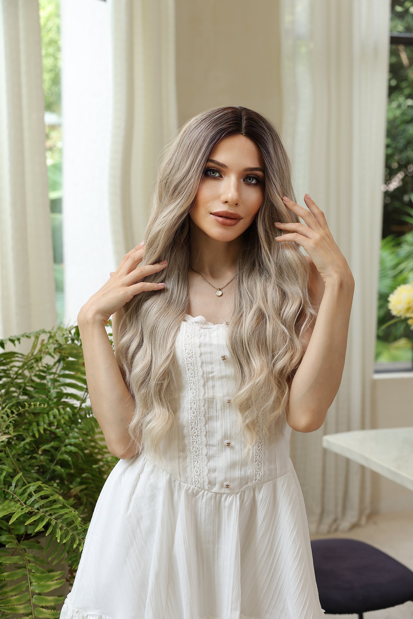 Long wavy synthetic wig with dark-root blend to light blonde, soft waves