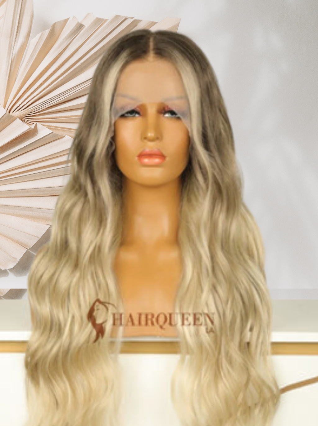 Lace wig with long wavy blonde hair, dark roots, center part