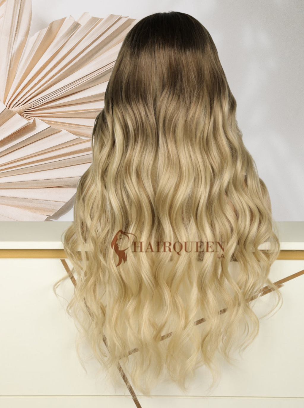 Lace wig with long wavy blonde hair, dark roots, back view