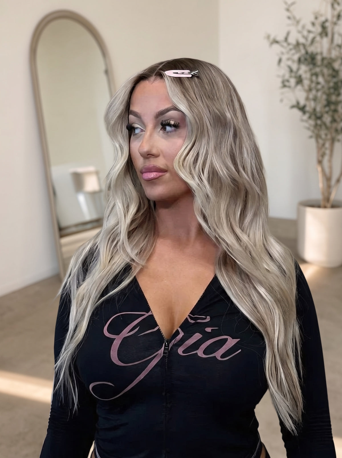 Long wavy blonde lace wig with side-swept waves and natural-looking hairline