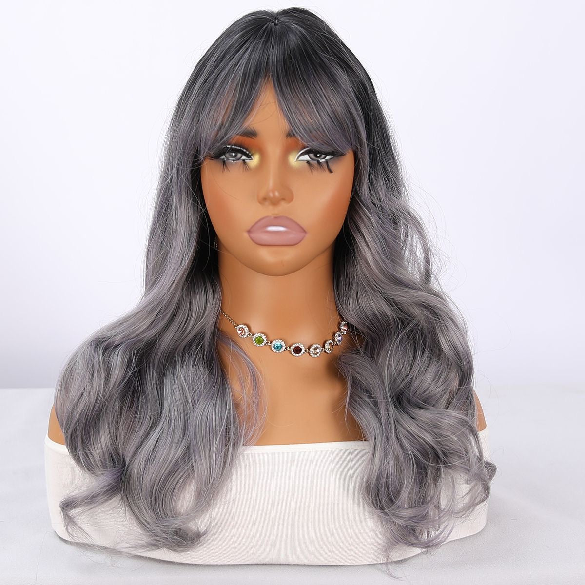 Long wavy silver-gray synthetic wig with bangs and center part