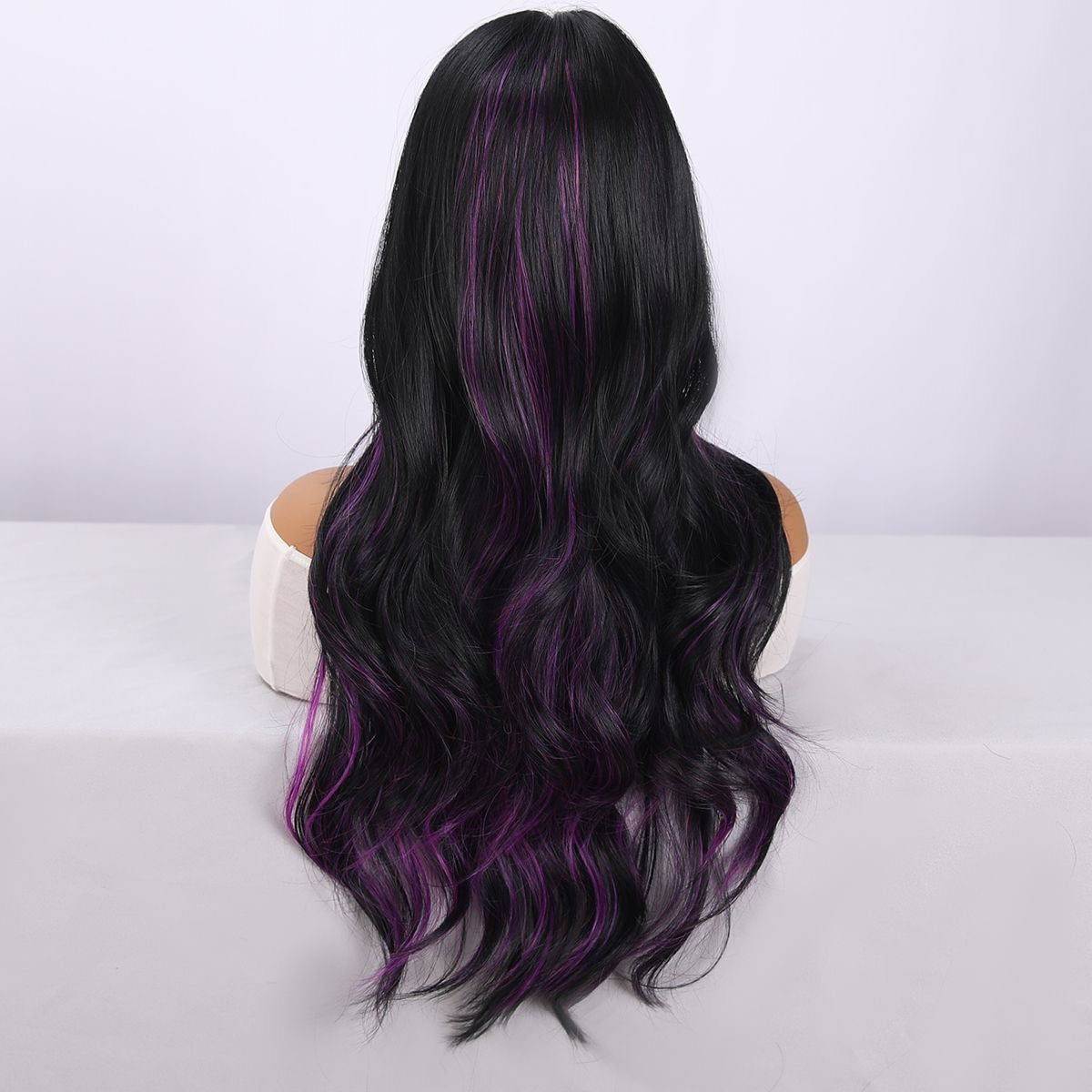 Long wavy wig back with black hair and purple accent highlights
