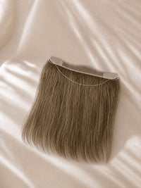 Curved hair topper with brown straight hair and thin transparent lace cap