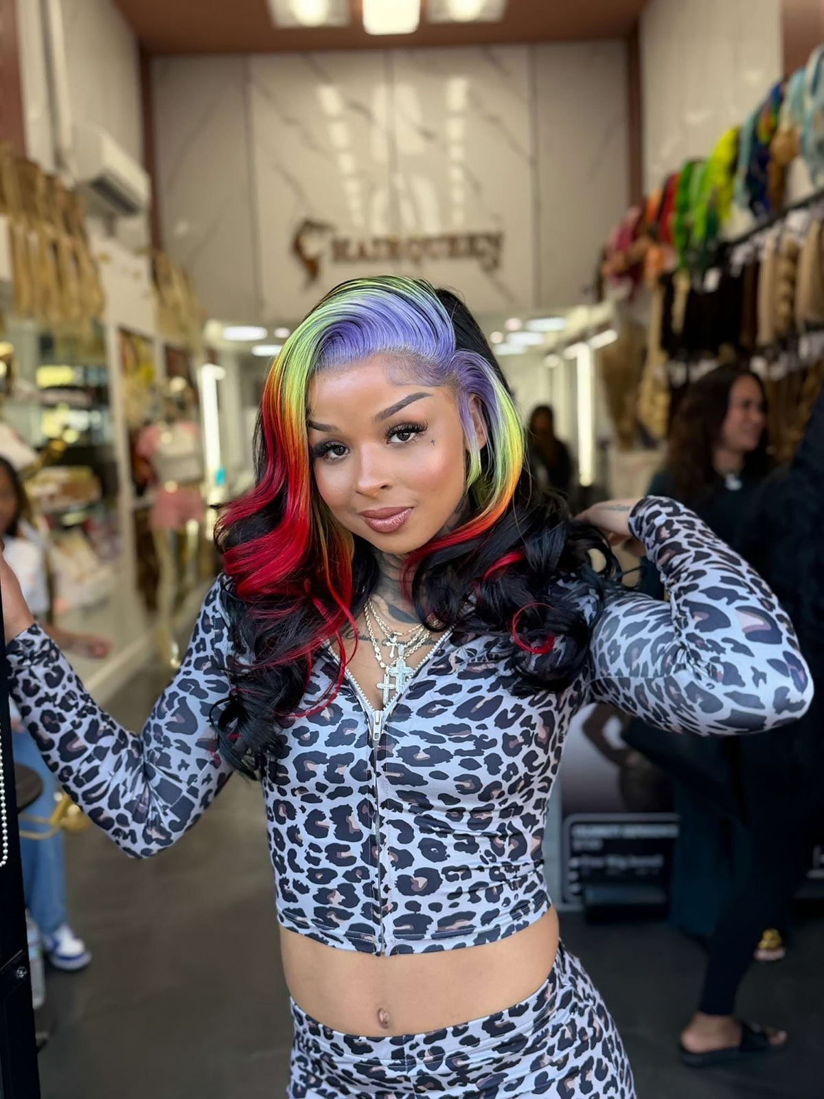 Rainbow lace wig with long wavy black hair and bright multicolor streaks, side view