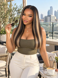 Sleek straight lace frontal worn long, dark-blonde hair with side part and shine