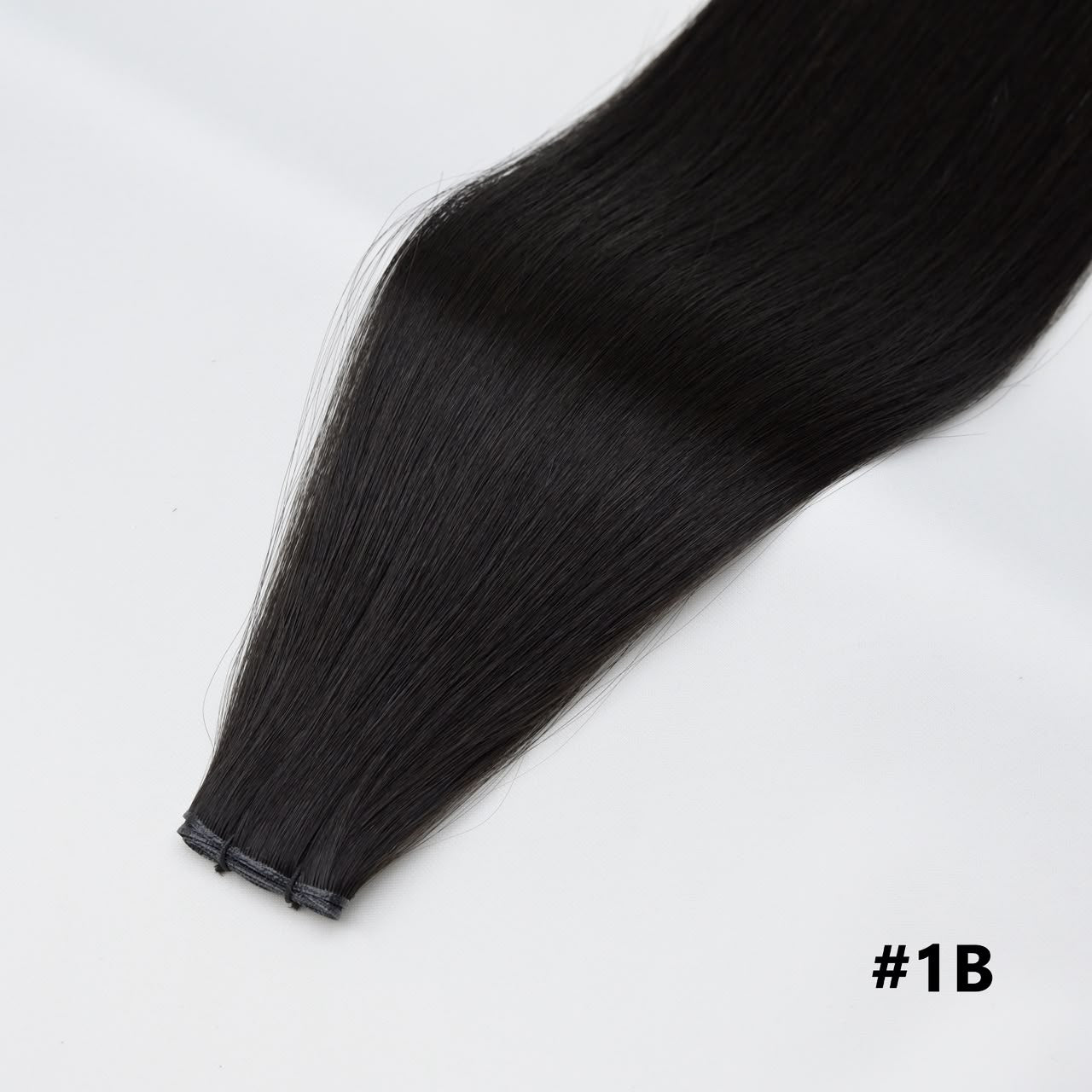 Tape-in hair extension, straight dark black #1B bundle with clips at the end