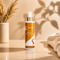 Hydrating leave-in conditioner spray bottle with orange label, white cap; Hair Queen LA