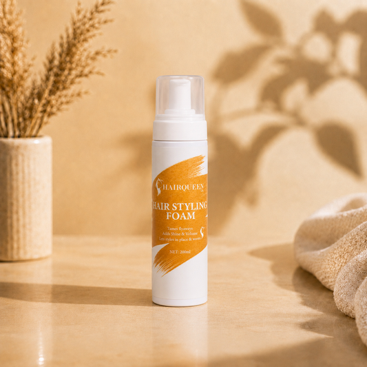 HQLA hair styling foam pump bottle on a smooth surface with towel and vase
