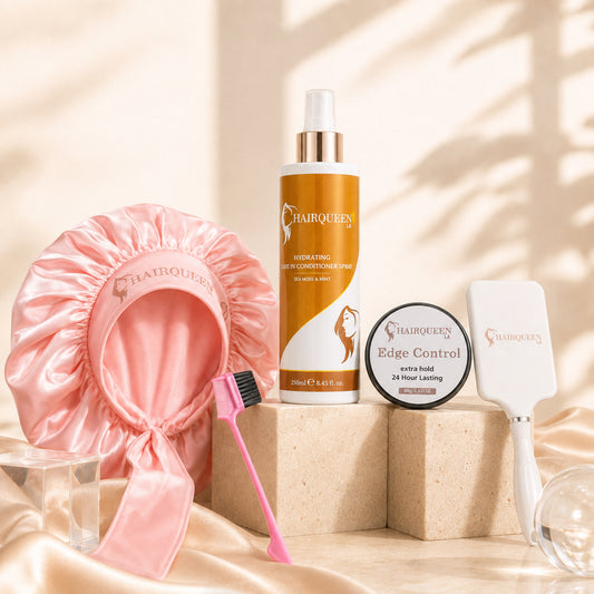 Hair extension care kit with pink satin bonnet, edge control jar, bottles, and brush