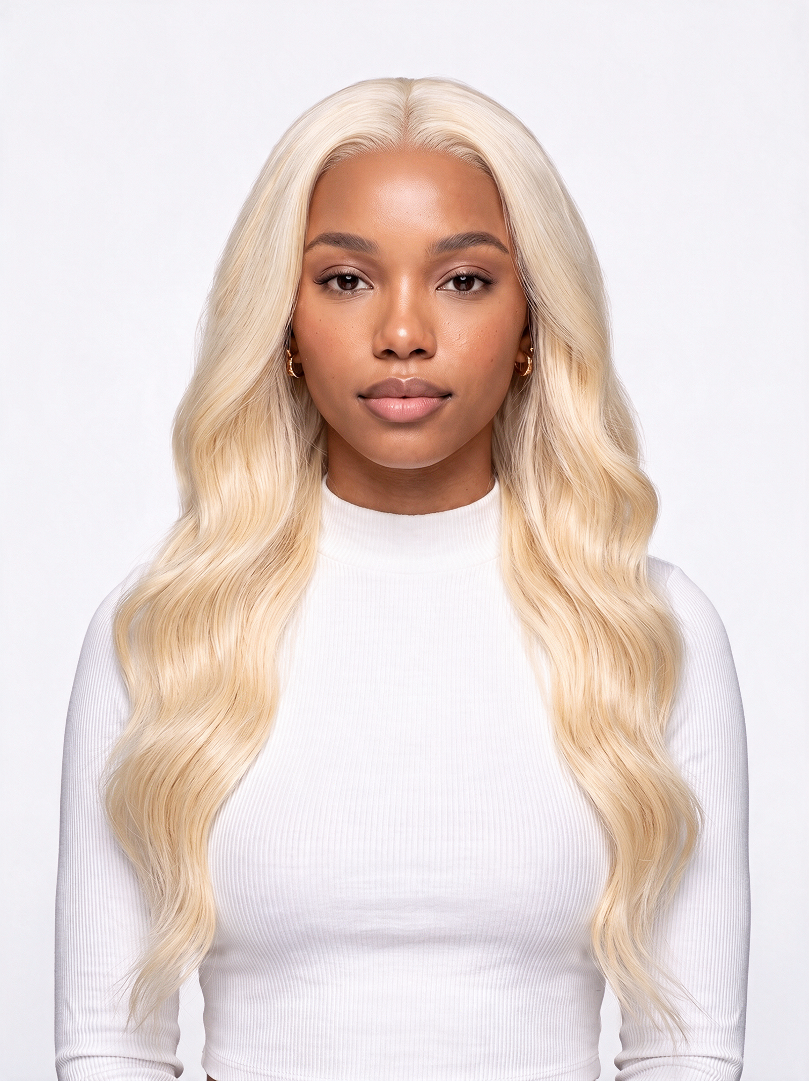 Long wavy 613 blonde lace wig worn with center parting, full coverage hair