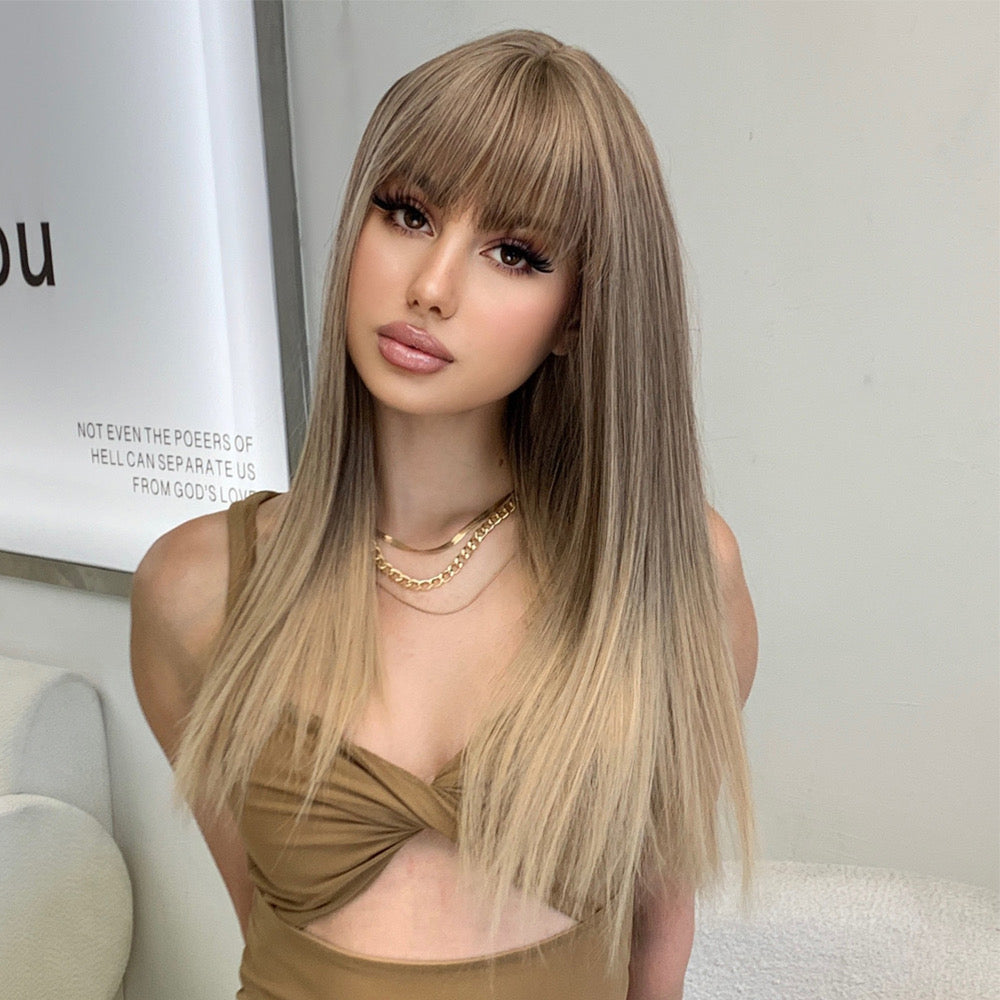 Long straight blonde wig with blunt bangs and layered highlights