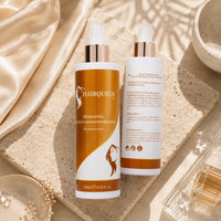 Hydrating leave-in conditioner spray bottles, orange front and white back label; Hair Queen LA