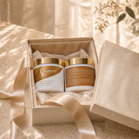 Hair repair mask jars in a cardboard gift box, both with gold lids