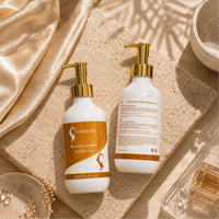 Reviving shampoo bottles set with gold pumps; white bottles with orange label text