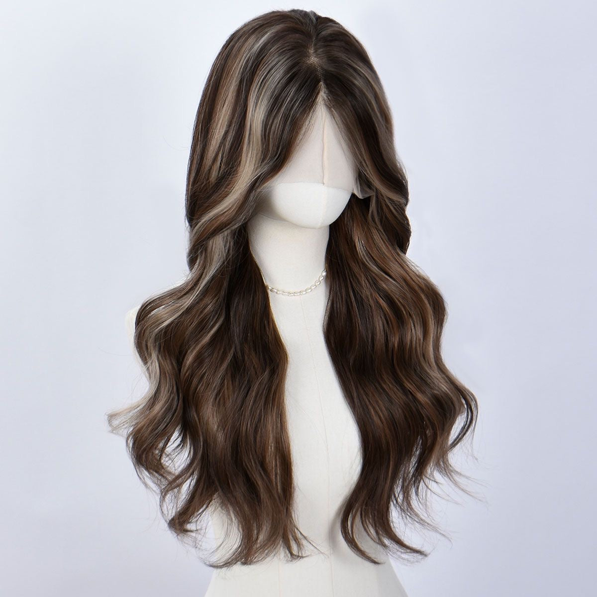 Long dark brown wig with lighter streaks, loose curls, side part, mannequin head