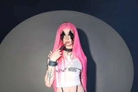 Long bright pink straight wig with blunt bangs and center part