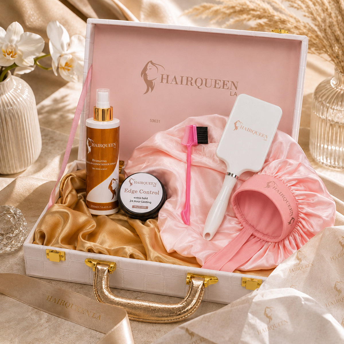 Hair care bundle in open case with pink bonnet, conditioner, edge control and brush