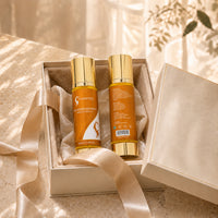 Hair repair serum in gift box, two amber-orange bottles with gold caps