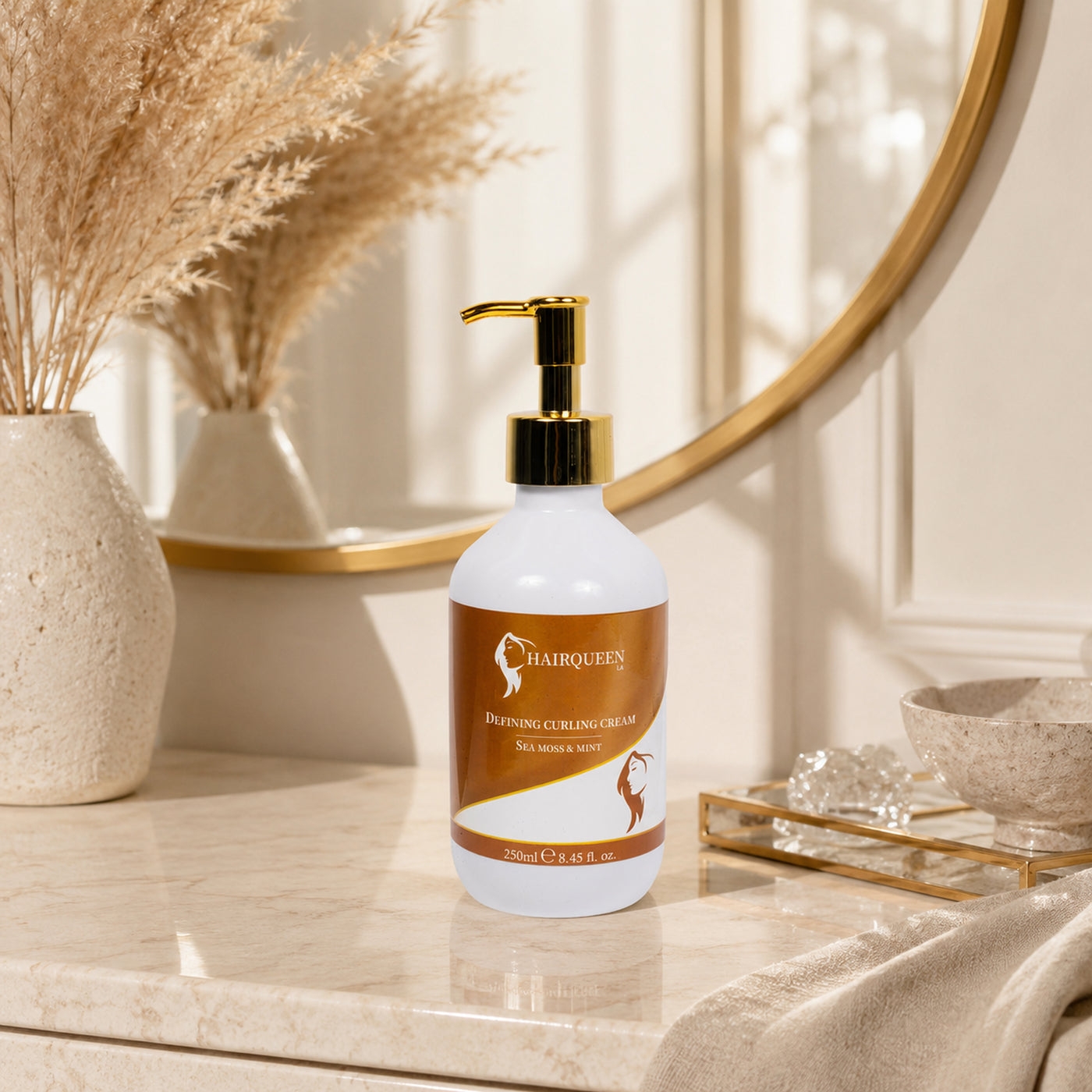 Curl cream bottle with gold pump on glass tray, white bottle and orange label