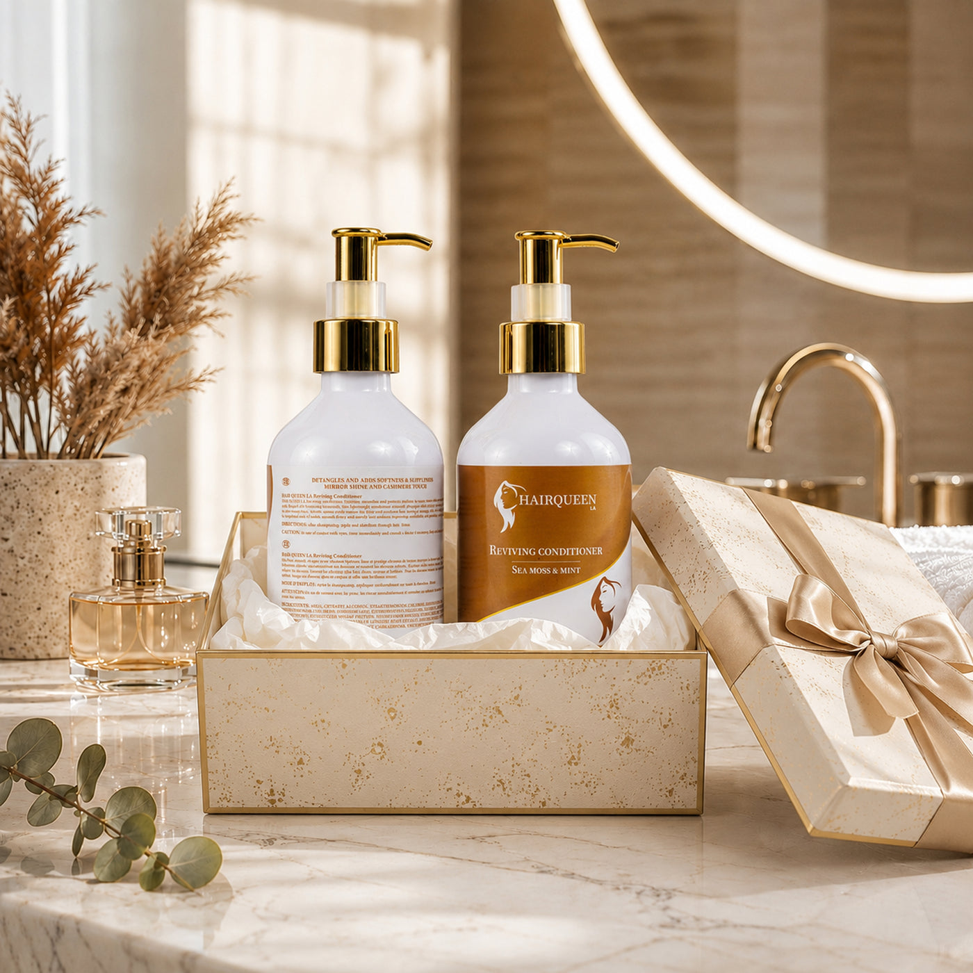 Two Hair Queen LA conditioner bottles with gold pumps, white bottles with amber label