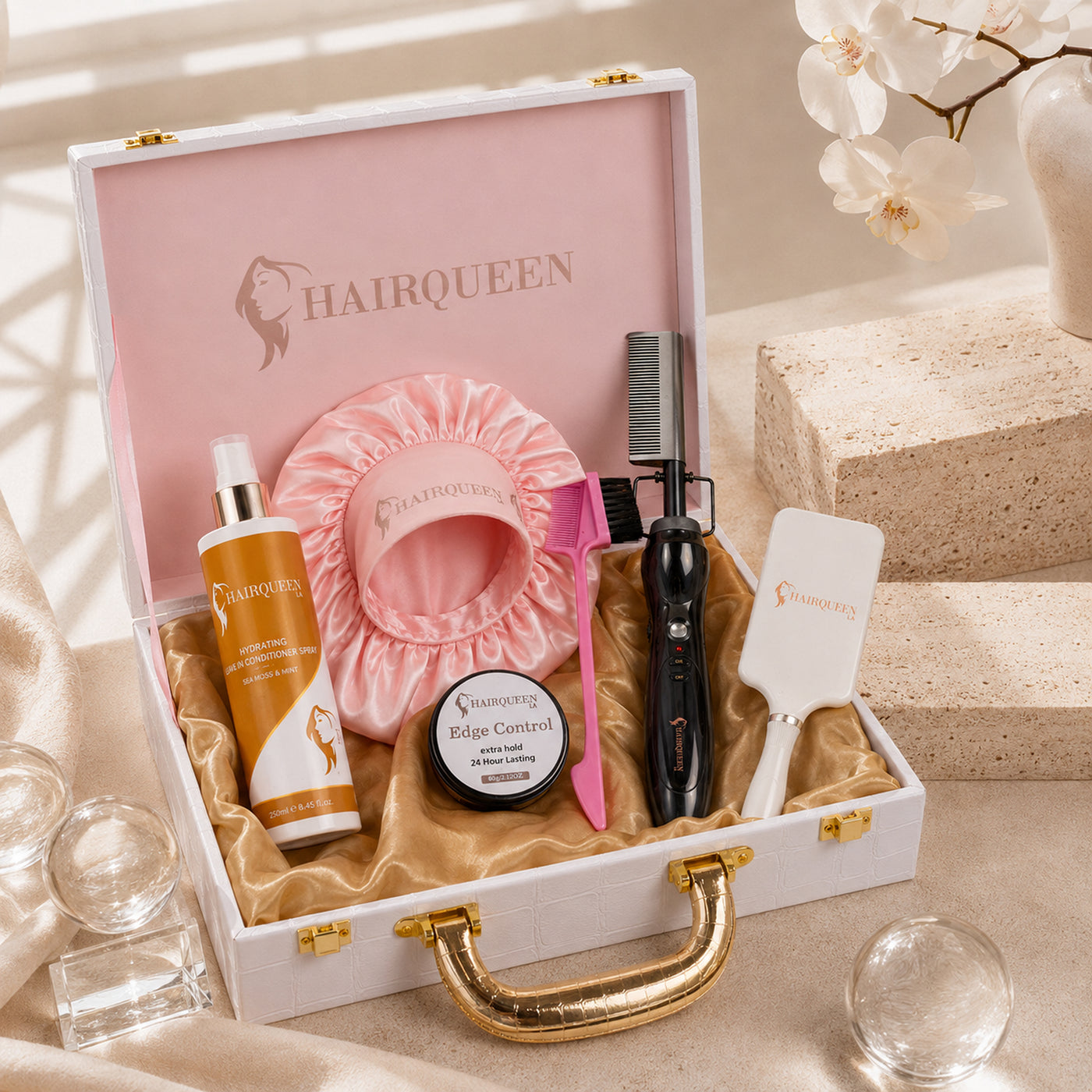 Hair care bundle kit with pink satin hair bonnet, edge control, heat brush, comb and bottles