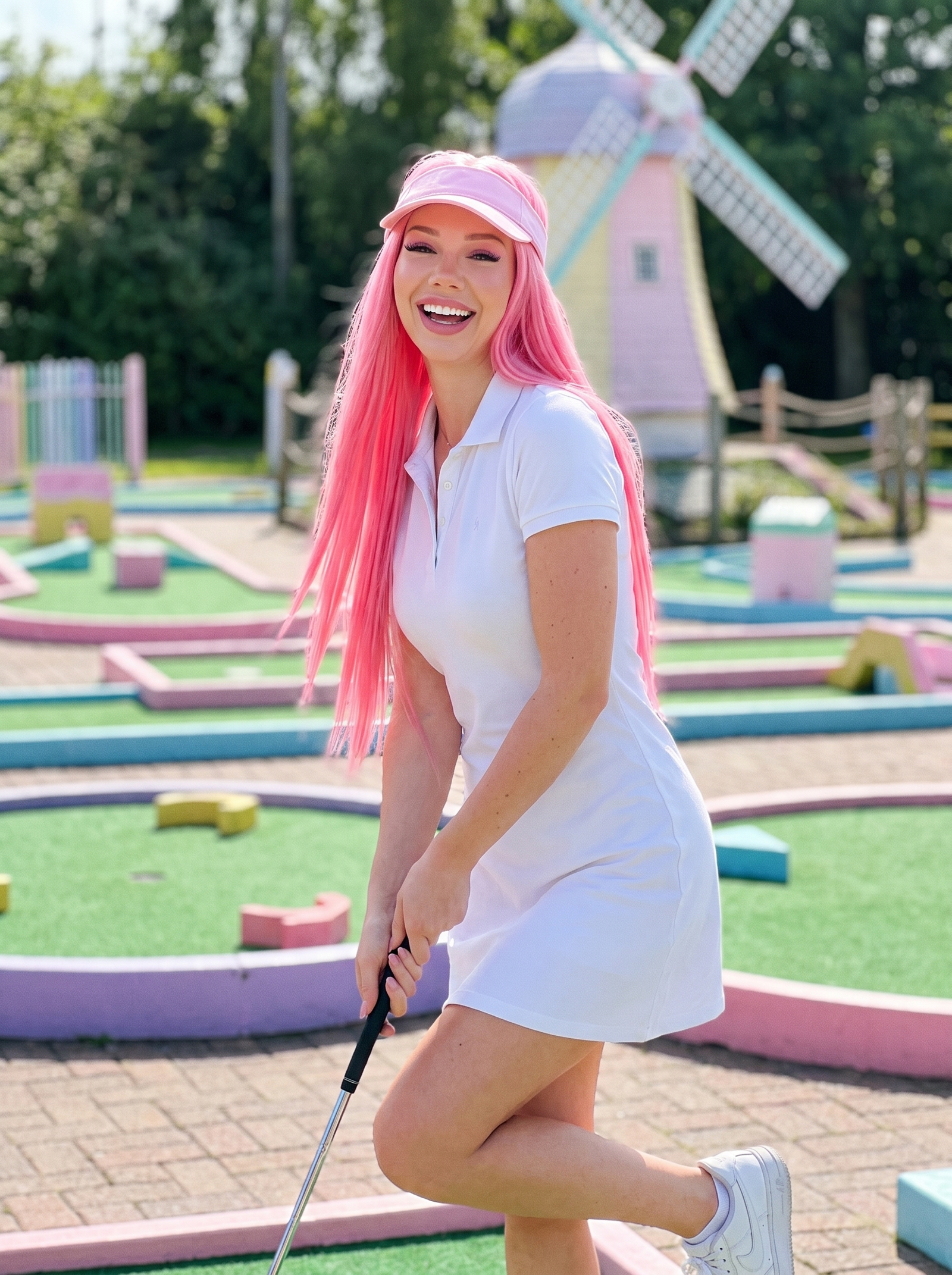 Hot pink straight wig worn by model outdoors, long hair with matching cap