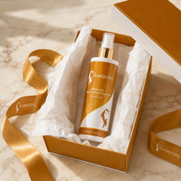 Hydrating leave-in conditioner spray bottle in open gift box, orange label and white cap