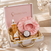 Open gift case with pink satin bonnet, edge control jar, and HAIRQUEEN spray bottle