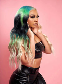 Long wavy ombre wig with black, green, and light blonde tones, side view.