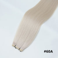 Tape-in hair extensions, straight strands in icy blonde #60A with visible tape clips