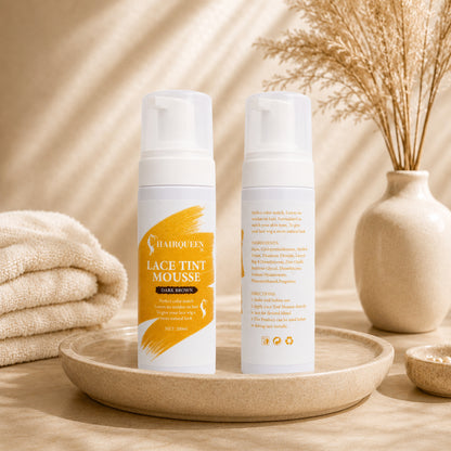 Two lace tint mousse bottles on round tray with folded towel