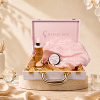 Open gift case showing HAIRQUEEN spray, pink satin bonnet, and edge control jar