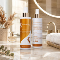 Hydrating leave-in conditioner spray bottles, front orange bottle and back label bottle; white caps