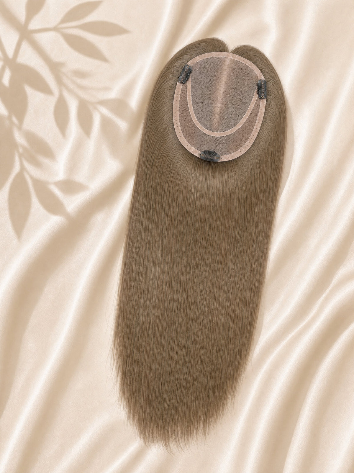 Light brown mono hair topper with round monofilament base, front view