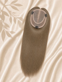 Light brown mono hair topper with round monofilament base, front view