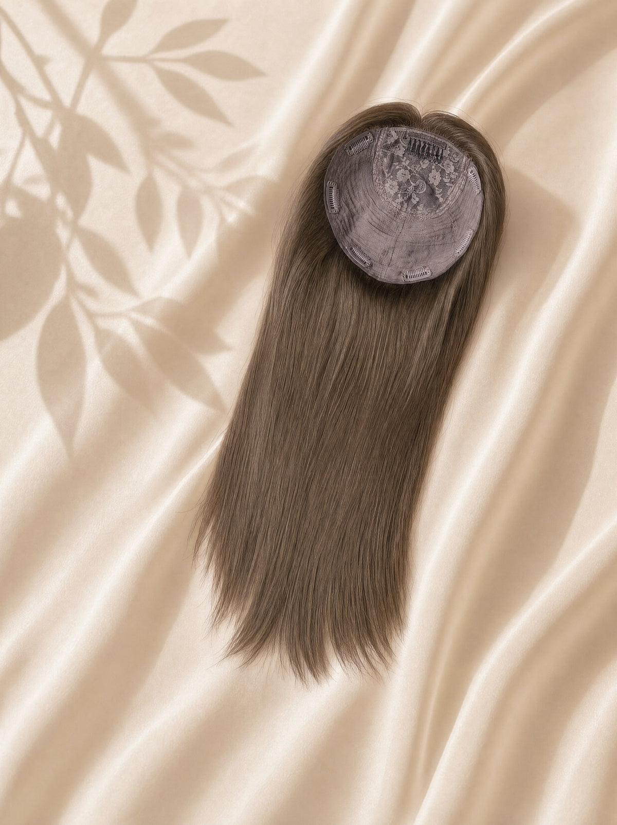 Silk base hair topper with straight ash-brown hair and visible circular silk base