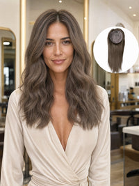 Silk base hair topper worn on model with long wavy ash-brown hair, natural blend