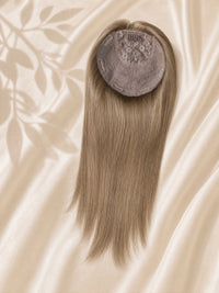 Clip-in silk base hair topper with light blonde straight hair, round gray base