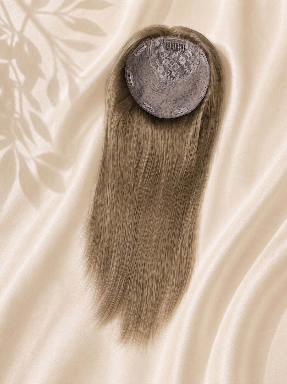 Light blonde hair topper with circular silk base cap, smooth straight strands