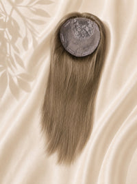 Light blonde hair topper with circular silk base cap, smooth straight strands