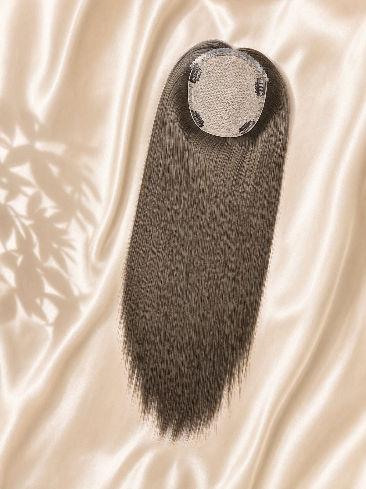 Light ash-blonde 6x7 silk skin hair topper shown on a fabric backdrop.