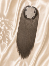 Light ash-blonde 6x7 silk skin hair topper shown on a fabric backdrop.