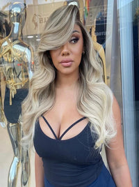 Long wavy wig in cool silver blonde with soft side-swept volume