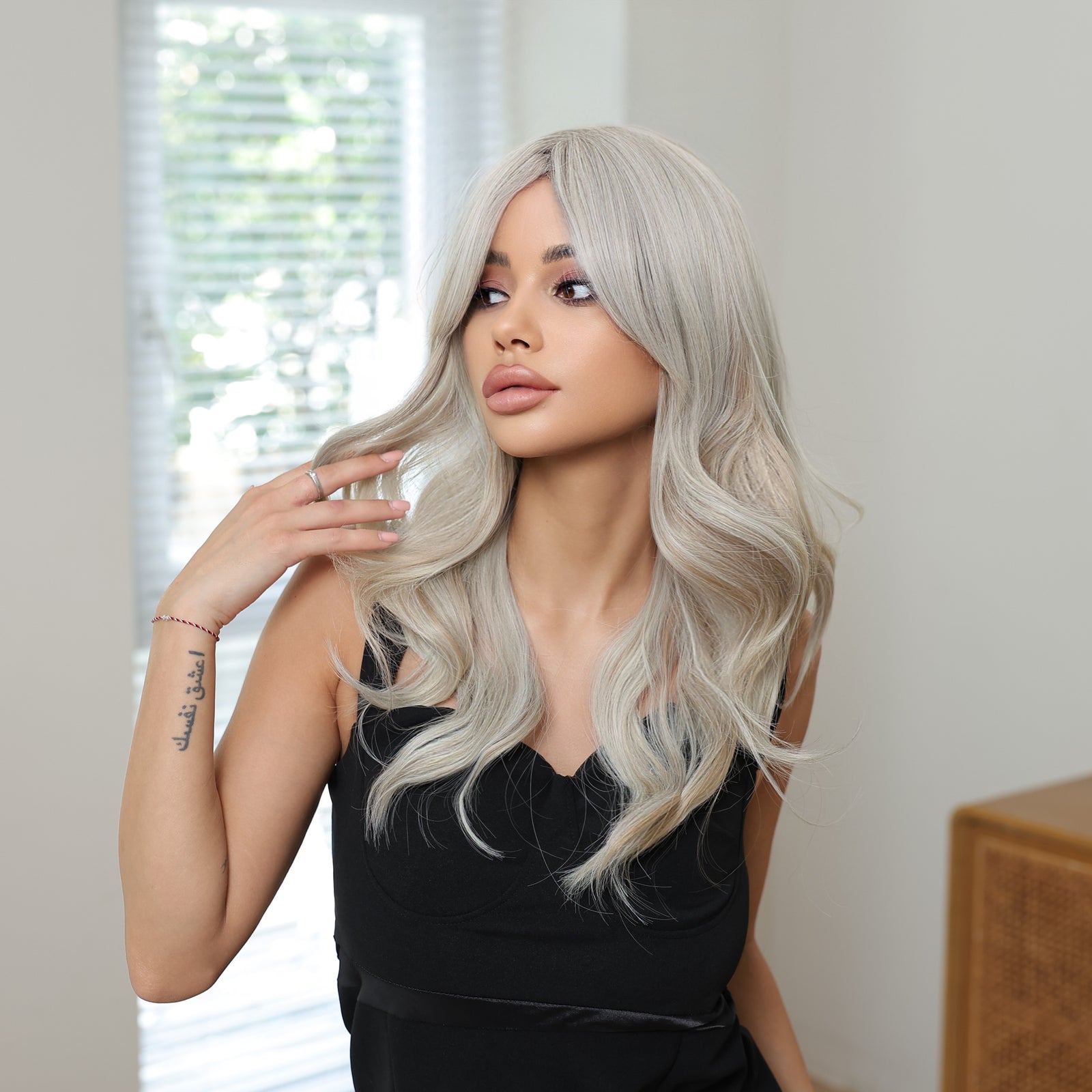 Synthetic blend wig with ash blonde long waves and curtain bangs