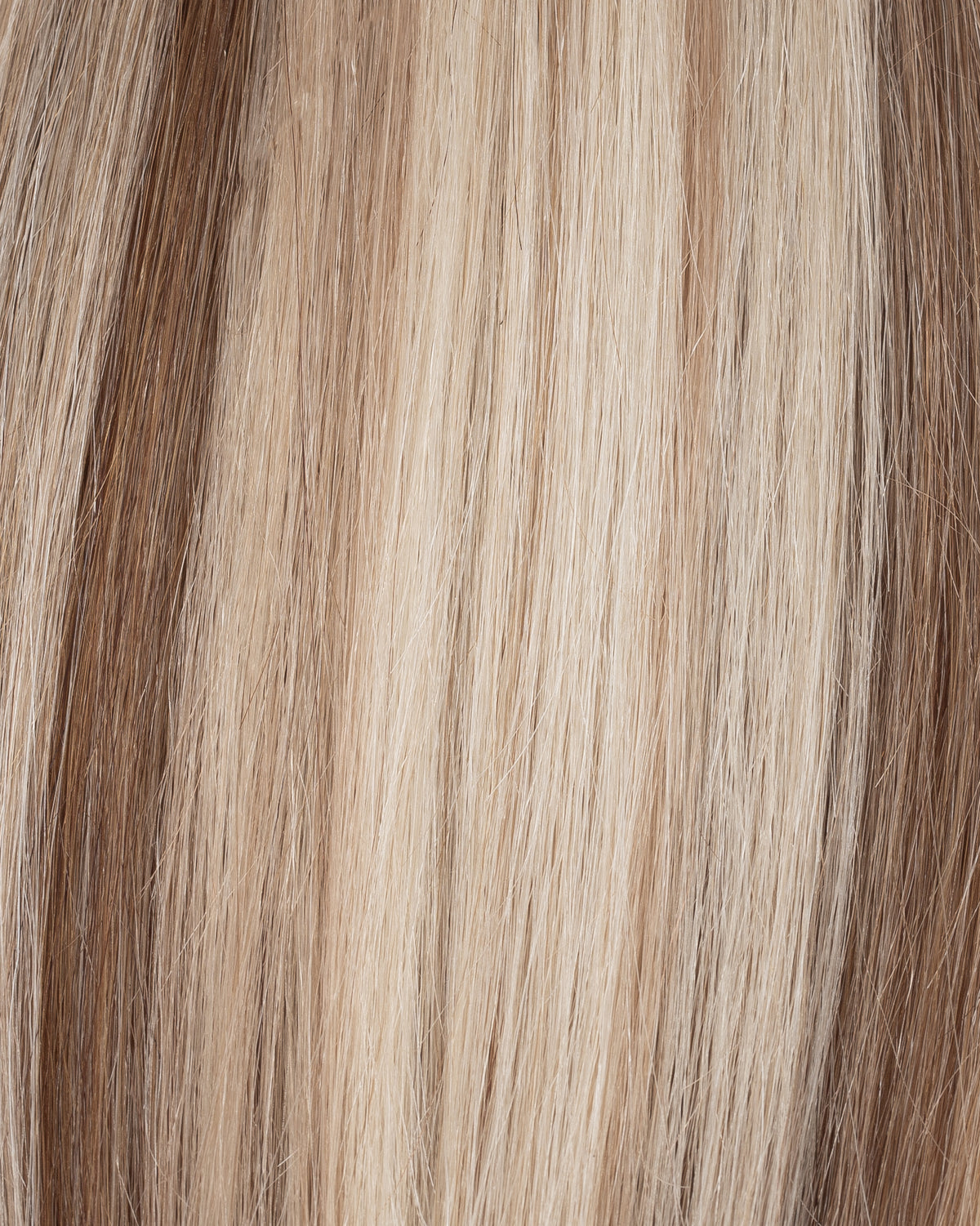 Blonde blend hair strands with lighter streaks, seamless clip-in extension