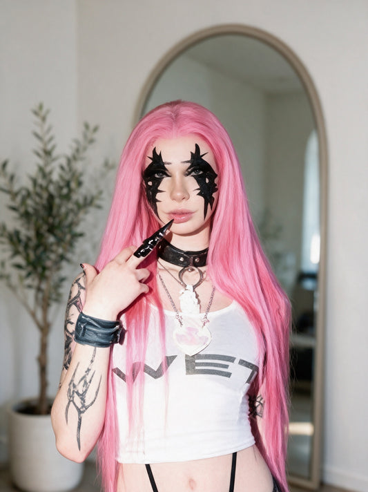 Long hot pink straight wig on model, center part and full volume