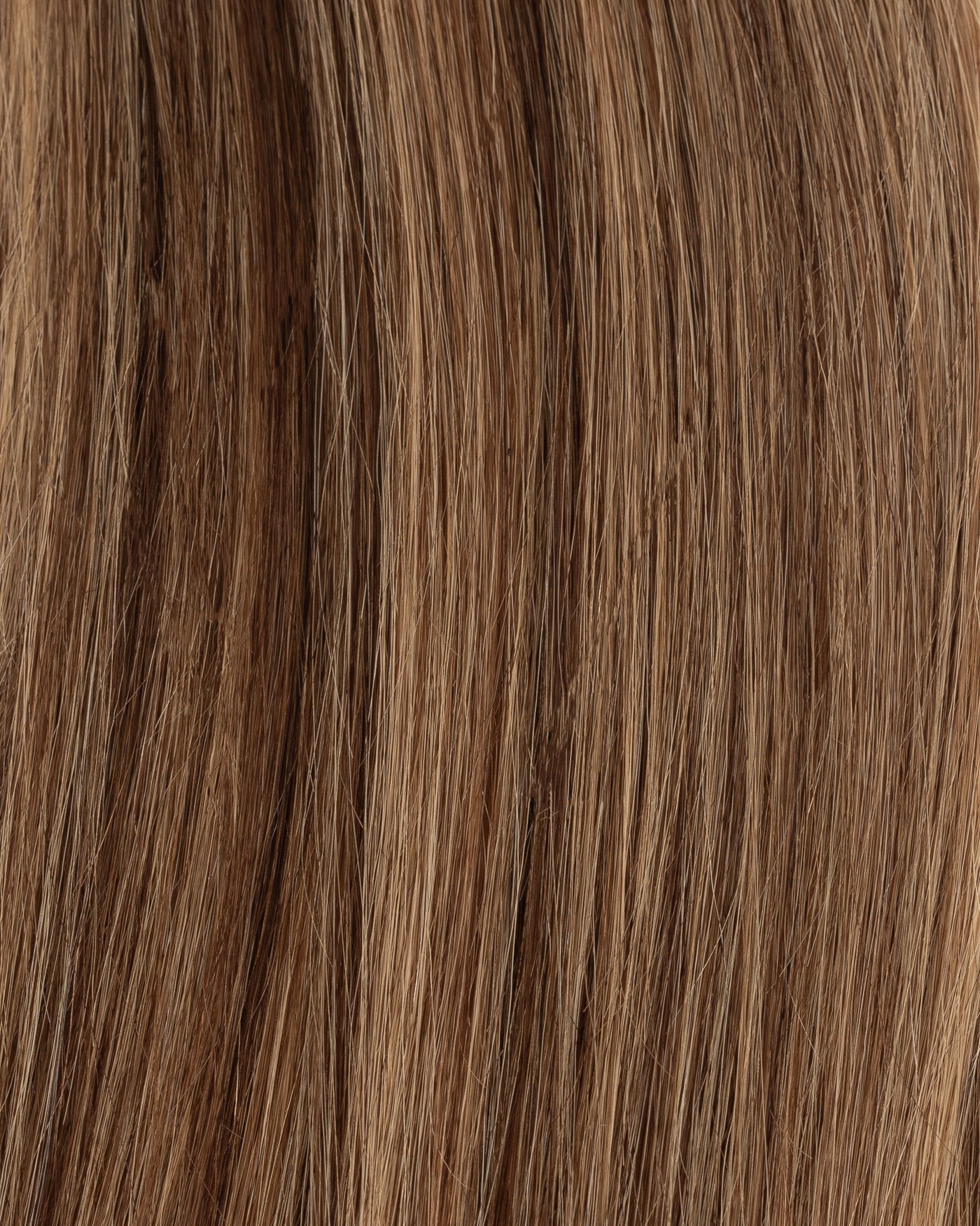 Caramel K-tips hair extensions, close-up of brown and caramel hair strands