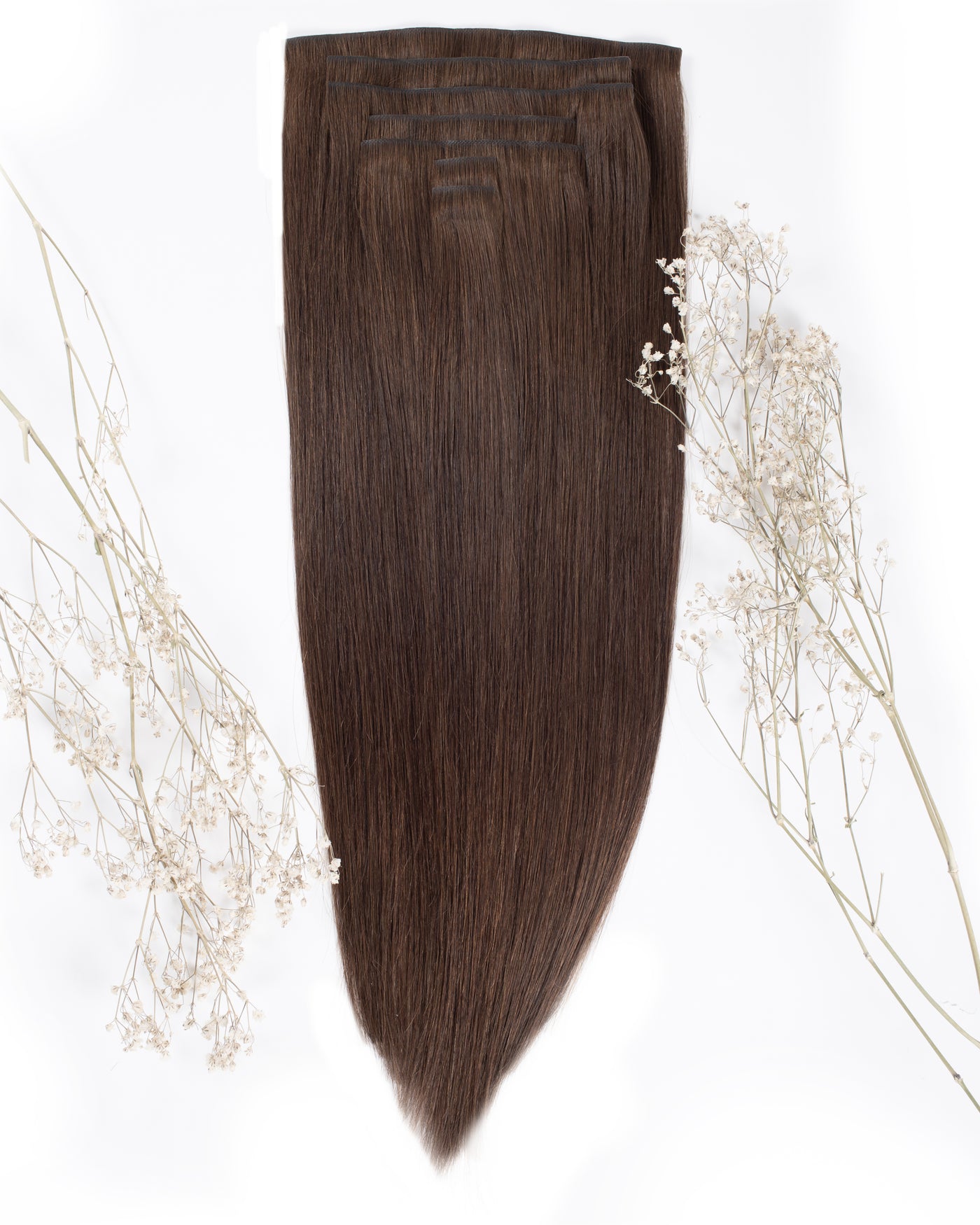 Chocolate-brown clip-in hair extension panel with smooth straight strands and tapered ends